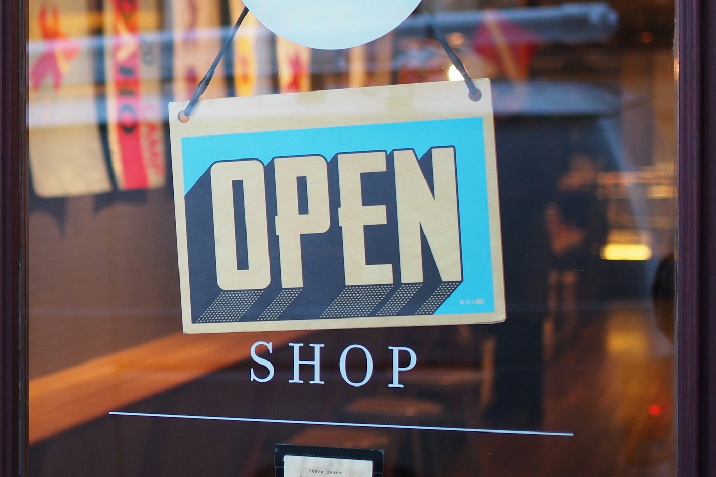 Open sign hanging in the shop door